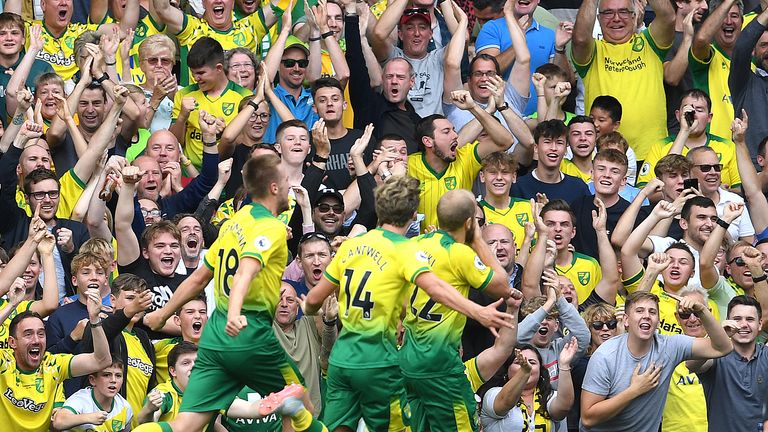Norwich City fans celebrate after striker Teemu Pukki scores during a Premier League game at Carrow Road in 2019