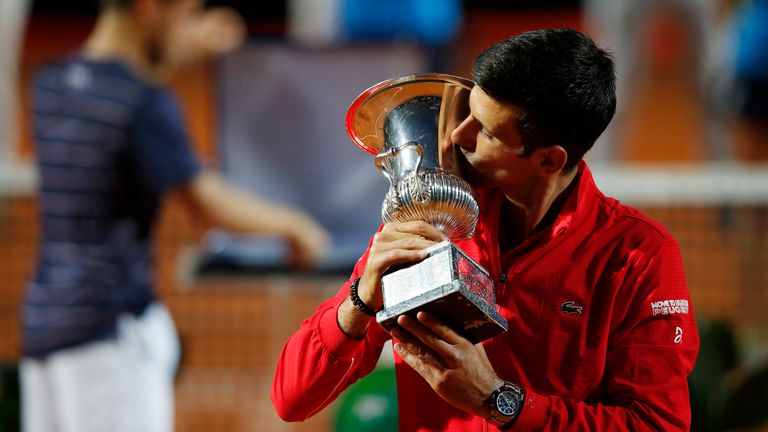 Novak Djokovic of Serbia celebrates with trophy after winning his men's final match against Diego Schwartzman of Argentina during day eight of the Internazionali BNL d'Italia at Foro Italico on September 21, 2020 in Rome, Italy.