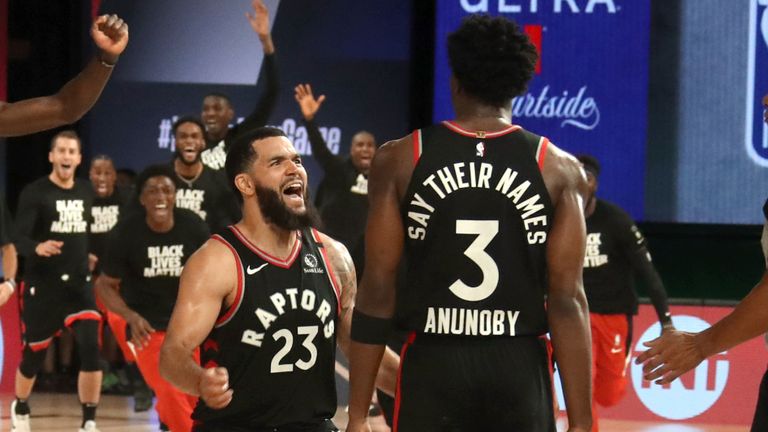 OG Anunoby is congratulated by team-mate Fred VanVleet after sinking a buzzer-beating three-pointer to win Game 3