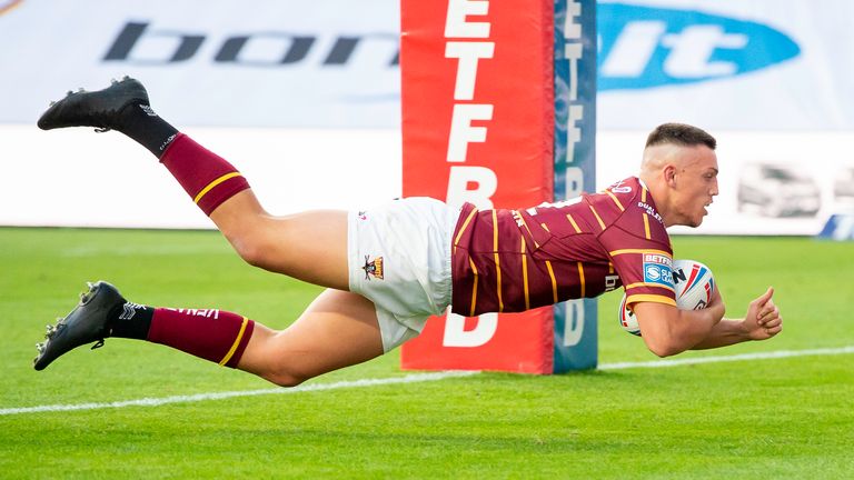 Huddersfield's Owen trout dives over for a try against St Helens