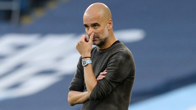 Pep Guardiola looks on with his side trailing Leicester City at the Etihad