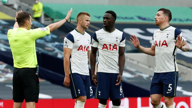 Tottenham players appeal to referee Peter Bankes after he awards Newcastle a penalty in stoppage-time