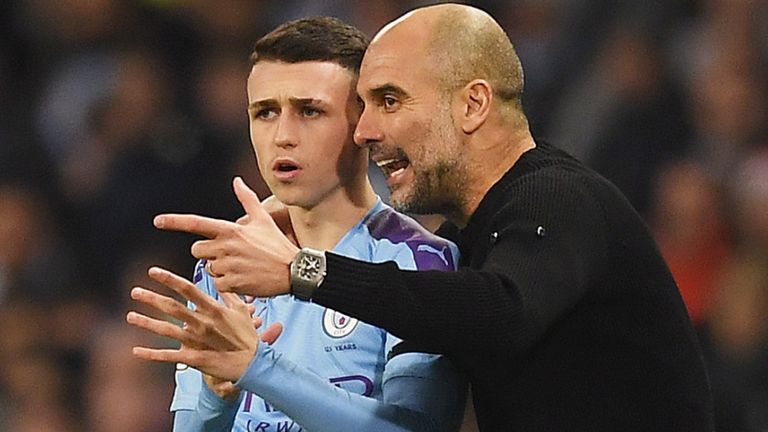 Phil Foden with Pep Guardiola