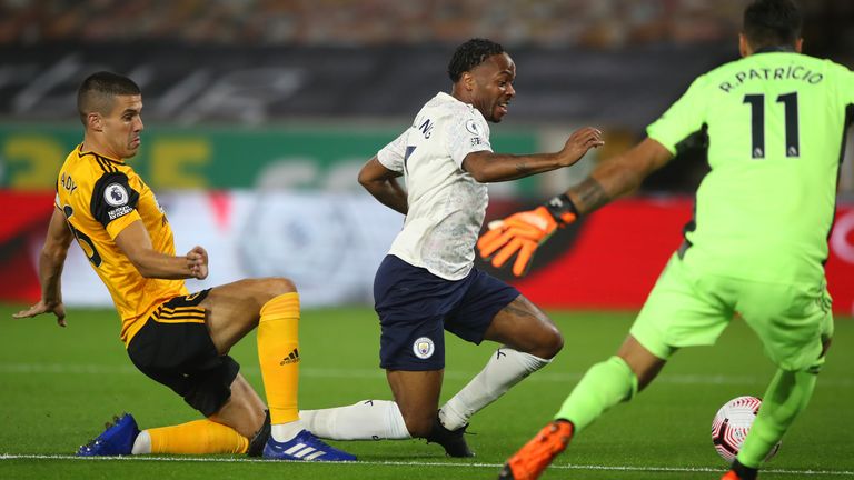 Raheem Sterling goes down under a challenge from Conor Coady