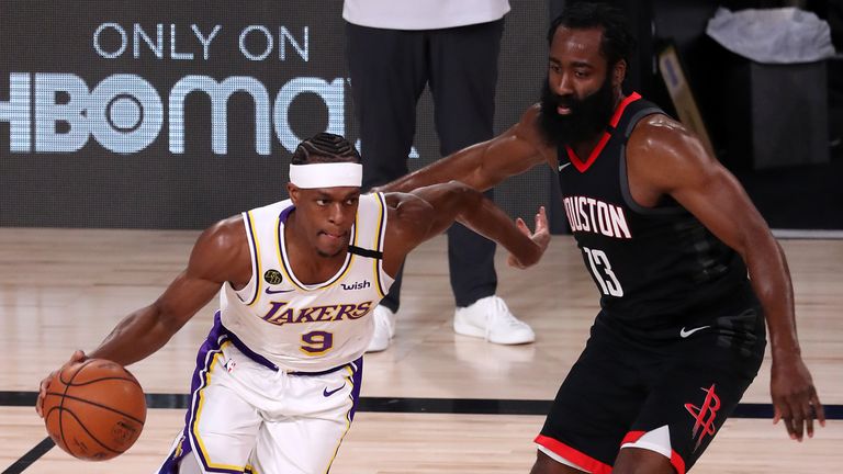 Rajon Rondo of the Los Angeles Lakers drives the ball against James Harden of the Houston Rockets during the first quarter in Game Three of the Western Conference