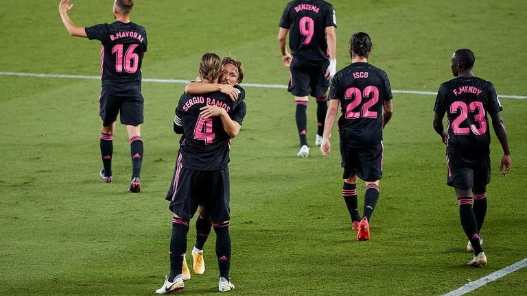 Luka Modric embraces Sergio Ramos after the defender's winning penalty
