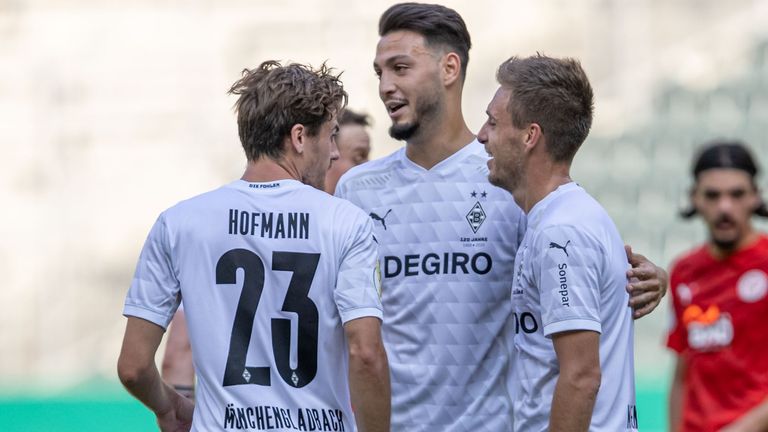 Gladbach's Ramy Bensebaini celebrates scoring his team's fourth goal 