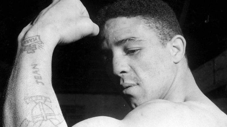 4th January 1951: British boxer and world middleweight champion Randolph Turpin (1928 - 1966) showing off his tattoos and biceps. (Photo by Chris Ware/Keystone Features/Getty Images)