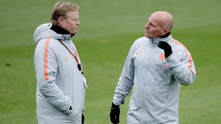 Ronald Koeman and Rene Wormhoudt discuss matters during a Netherlands training session