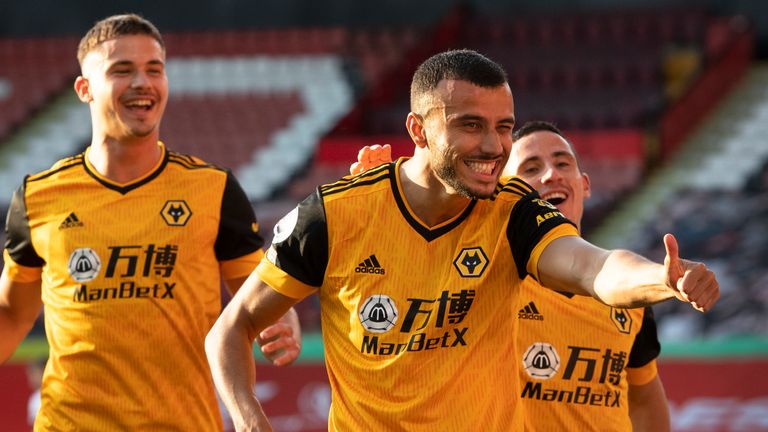 Romain Saiss celebrates scoring Wolves' second goal