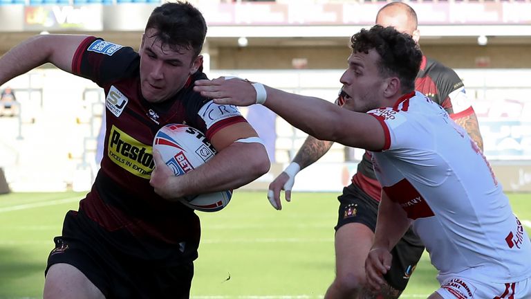 Wigan's Harry Smith (left) scores his side's second try against Hull KR