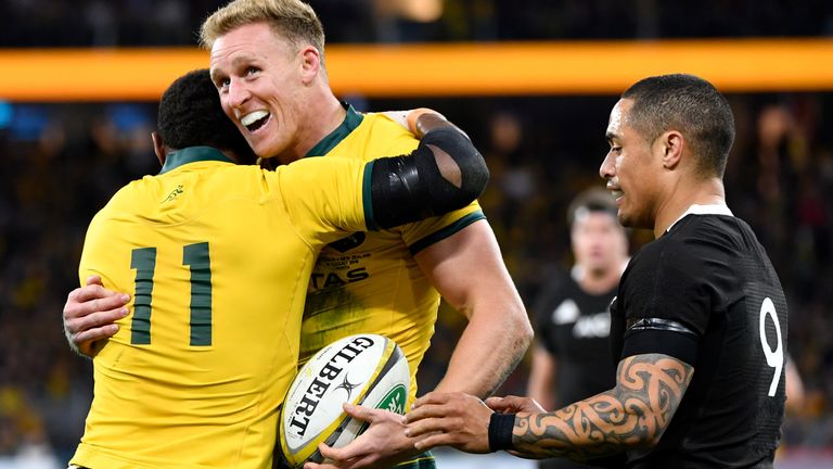 Reece Hodge celebrates with Marika Koroibete after scoring a try against New Zealand during the 2019 Rugby Championship 