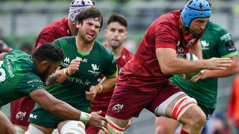 Tadhg Beirne beats the tackle of Bundee Aki of Connacht on the way to scoring his side's fourth try