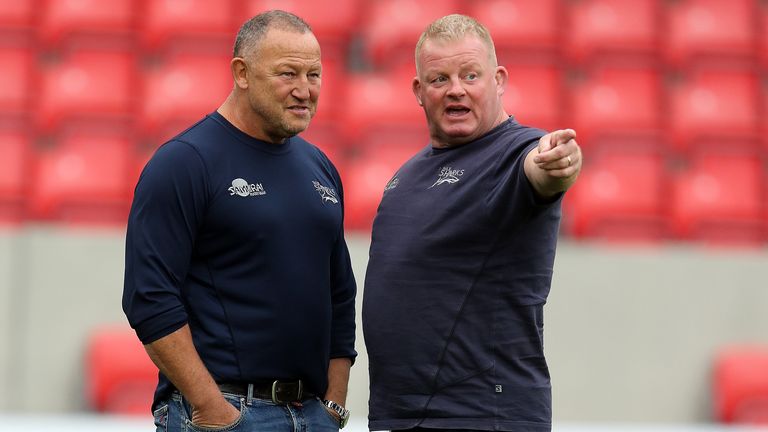 Steve Diamond, (L) the Sale Sharks director of rugby talks to Dorian West, the scrum coach during