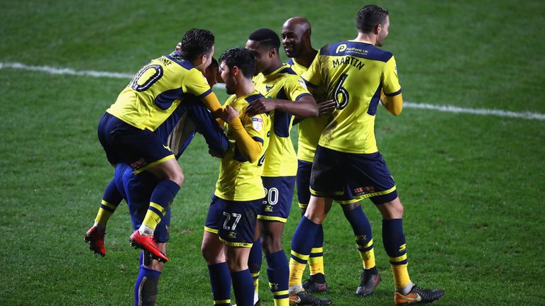 Scott Shearer is mobbed by team-mates following the EFL Checkatrade Trophy Third Round match between Charlton Athletic and Oxford United at The Valley on January 9, 2018 in London, England.