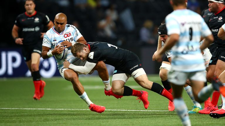 Elliot Daly puts in a big tackle on Simon Zebo