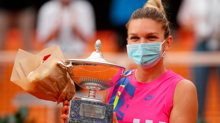 Romania's Simona Halep poses with her trophy after winning the final match of the Women's Italian Open against Czech Republic's Karolina Pliskova, who pulled out following injury, at Foro Italico on September 21, 2020 in Rome, Italy. 