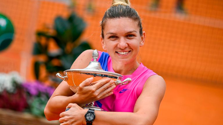 Romania's Simona Halep poses with her trophy after winning the final match of the Women's Italian Open against Czech Republic's Karolina Pliskova, who pulled out following injury, at Foro Italico on September 21, 2020 in Rome, Italy.