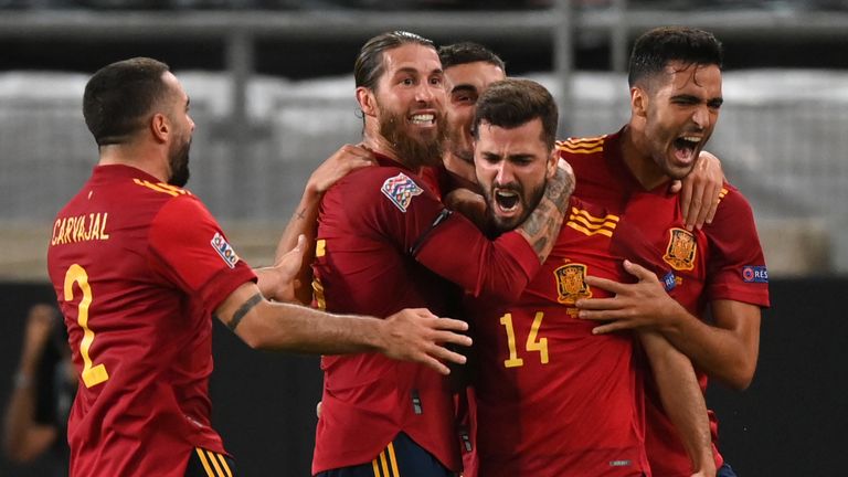 Spain celebrate after Jose Gaya's injury-time equaliser against Germany
