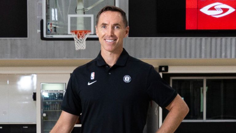 Steve Nash poses for pictures at the Brooklyn Nets training facility