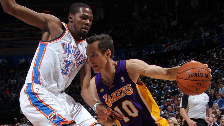 Steve Nash of the Los Angeles Lakers drives to the basket against Kevin Durant of the Oklahoma City Thunder