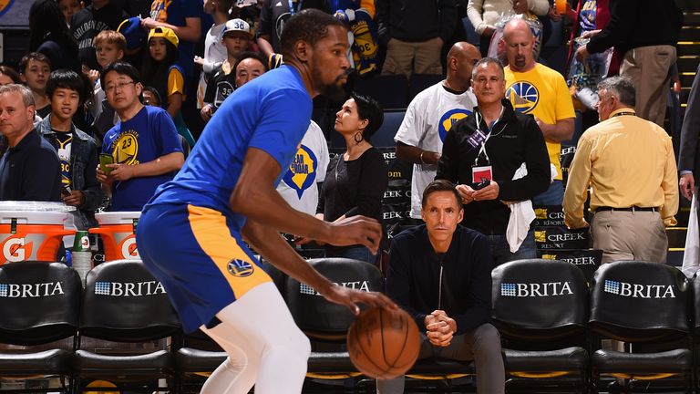 Steve Nash looks on as Kevin Durant of the Golden State Warriors warms up prior to the game against the Indiana Pacers