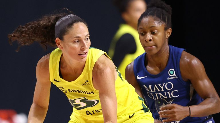 Sue Bird of the Seattle Storm posts up Crystal Dangerfield of the Minnesota Lynx