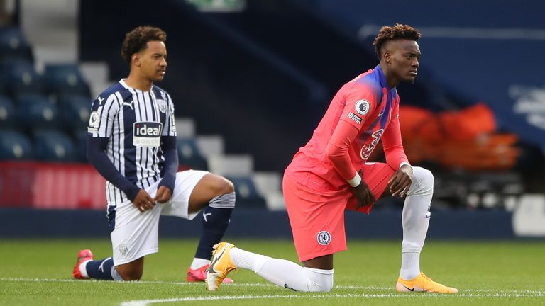Chelsea's Tammy Abraham and West Brom's Matheus Pereira take the knee before kick-off in support of Black Lives Matter