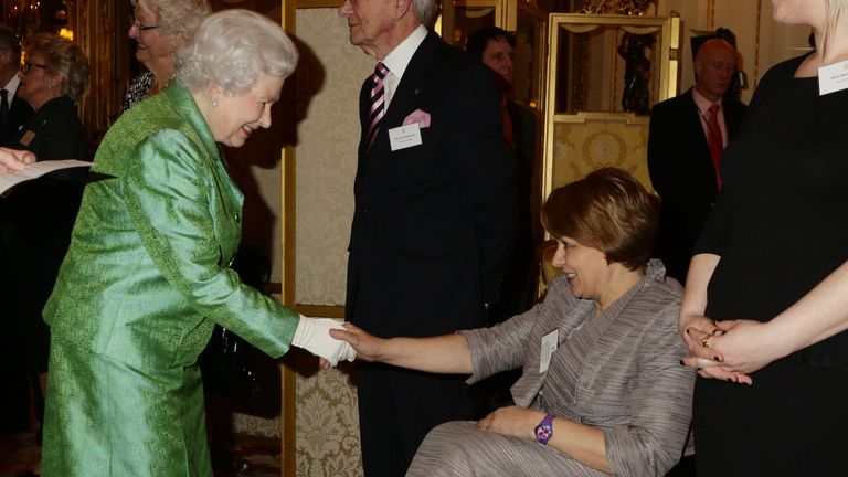 Queen Elizabeth II meets Baroness Tanni Grey-Thompson as she hosts the Winston Churchill Memorial Trust Reception at Buckingham Palace, London. PRESS ASSOCIATION Photo. Picture date: Wednesday March 18, 2015. Photo credit should read: Yui Mok/PA Wire