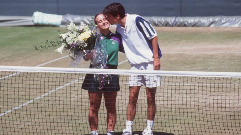 TIM HENMAN OF GREAT BRITAIN KISSES WIMBLEDON BALLGIRL CAROLINE HALL ON THE CHEEK AT A PRESS PHOTOCALL AT THE 1995 WIMBLEDON TENNIS CHAMPIONSHIPS. HENMAN ACCIDENTLY HIT CAROLINE HALL WITH A BALL DURING HIS DOUBLES MATCH WITH JEREMY BATES YESTERDAY. HE WAS DISQUALIFIED FROM THE EVENT BECAUSE THE BALL WAS HIT IN ANGER AT AN OFFICIAL