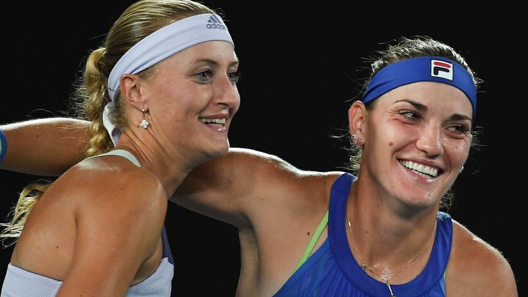 Hungary's Timea Babos (R) and France's Kristina Mladenovic (L) celebrates their victory against Taiwan's Hsieh Su-wei and Czech Republic's Barbora Strycova during the women's doubles final on day twelve of the Australian Open tennis tournament in Melbourne on January 31, 2020.