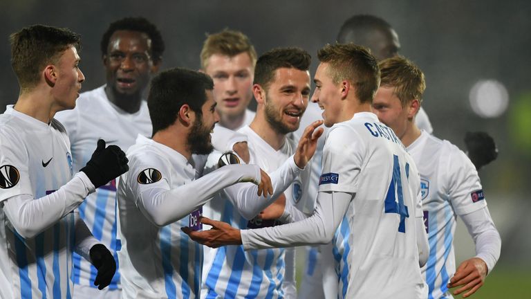 Timothy Castagne (R) of KRC Genk celebrates scoring the 1-0 goal with his teammates during the UEFA Europa League round of 32 first-leg football match between FC Astra and RC Genk in Giurgiu, Romania on February 16, 2017. 