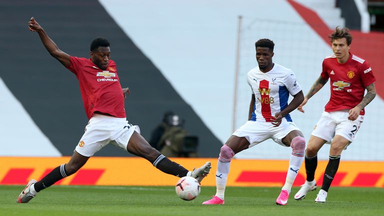 Timothy Fosu-Mensah (L) in action with Wilfried Zaha 