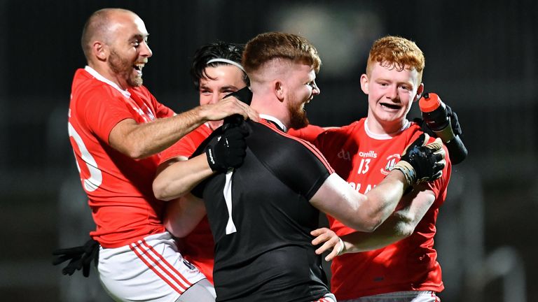 Trillick goalkeeper Ryan Kelly who saved a penalty to win the shootout, celebrates with his teammates on Friday night