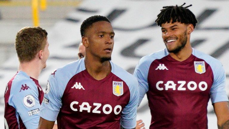 Tyrone Mings celebrates after Villa extend their lead at Craven Cottage