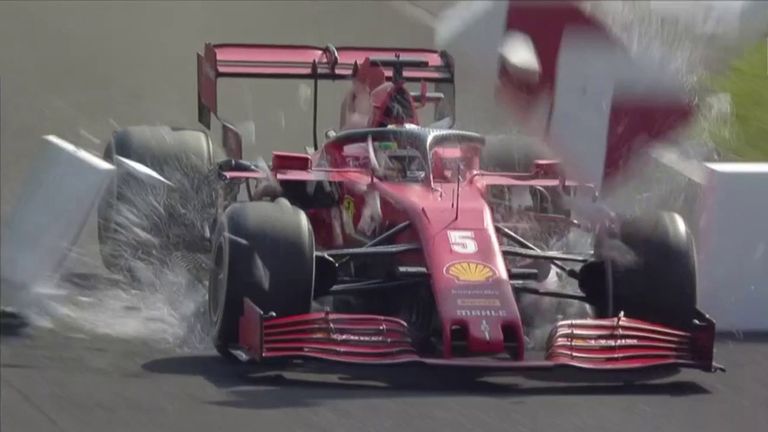 Sebastian Vettel crashes through the polystyrene boards after suffering brake failure during the Italian GP.