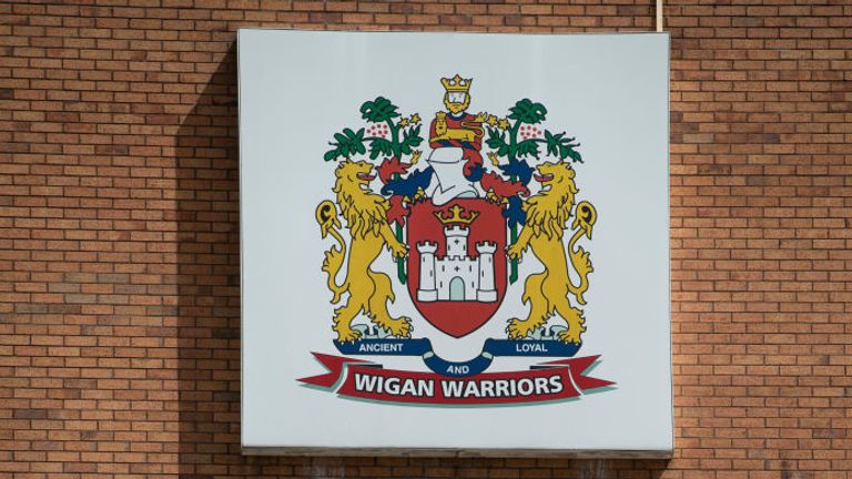 WIGAN, ENGLAND - JULY 06: The club crest of Wigan Warriors RLFC outside the DW Stadium, home of Wigan Athletic FC and Wigan Warriors RLFC on July 6, 2020 in Wigan, United Kingdom. (Photo by Visionhaus)