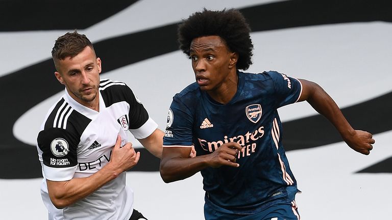 Willian takes on Fulham's Joe Bryan at Craven Cottage