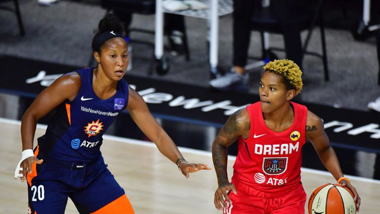 Courtney Williams #10 of the Atlanta Dream controls the ball against Briann January #20 of the Connecticut Sun during the first half at Field Entertainment Center on September 11, 2020 in Palmetto, Florida. 
