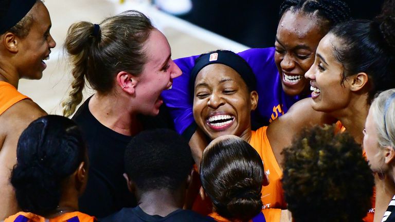 Shey Peddy #5 of the Phoenix Mercury is surrounded by teammates after hitting a 3-point buzzer beater to defeat the Washington Mystics in Game One of their First Round playoff