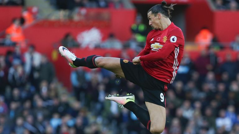 Manchester United's Swedish striker Zlatan Ibrahimovic jumps and kicks the air as he celebrates scoring his team's second goal during the English Premier League football match between Swansea City and Manchester United at The Liberty Stadium in Swansea, south Wales on November 6, 2016