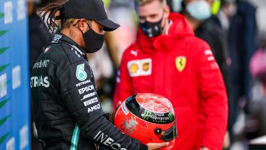 Hamilton presented with Schumacher helmet