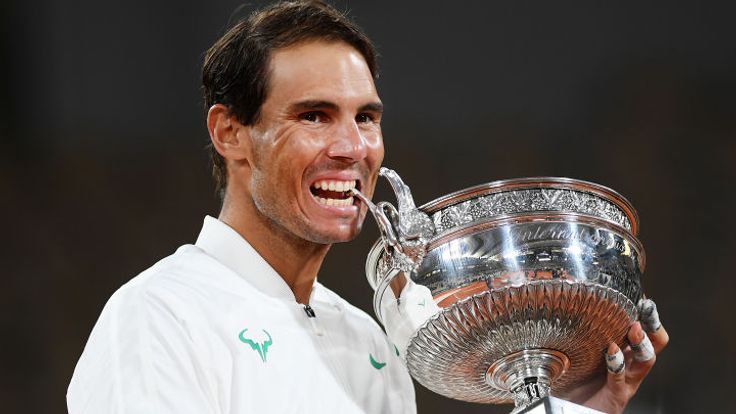 Rafael Nadal of Spain bites the winners trophy following victory in his Men's Singles Final against Novak Djokovic of Serbia on day fifteen of the 2020 French Open at Roland Garros on October 11, 2020 in Paris, France. 