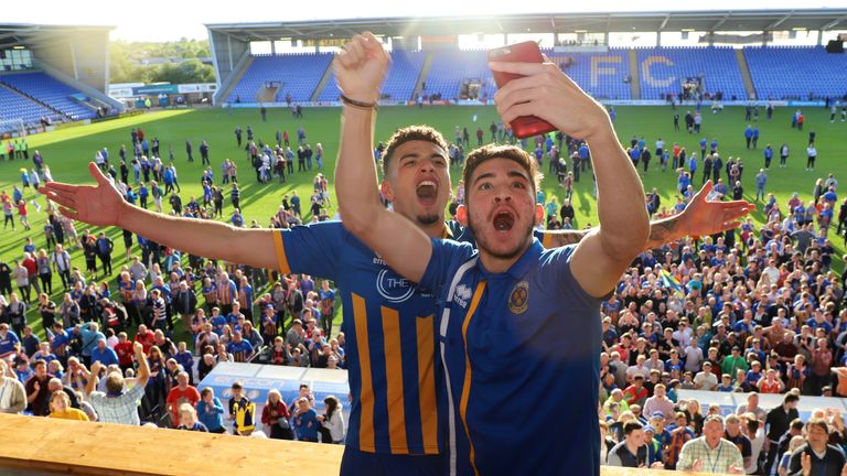 Ben Godfrey and Christos Shelis of Shrewsbury Town celebrate at full time after the Sky Bet League One Play Off Semi Final:Second Leg between Shrewsbury Town and Charlton Athletic at New Meadow on May 13, 2018 in Shrewsbury, England