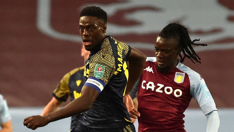 Bruno Martins Indi holds off Bertand Traore during the Carabao Cup contest