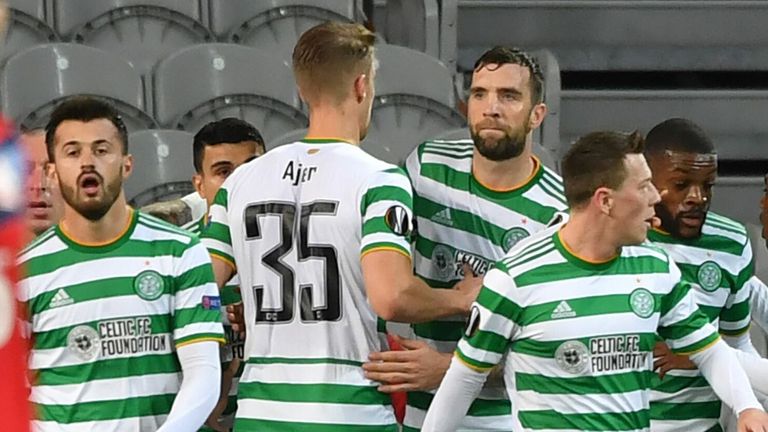 Celtic's players celebrate after scoring a goal against Lille