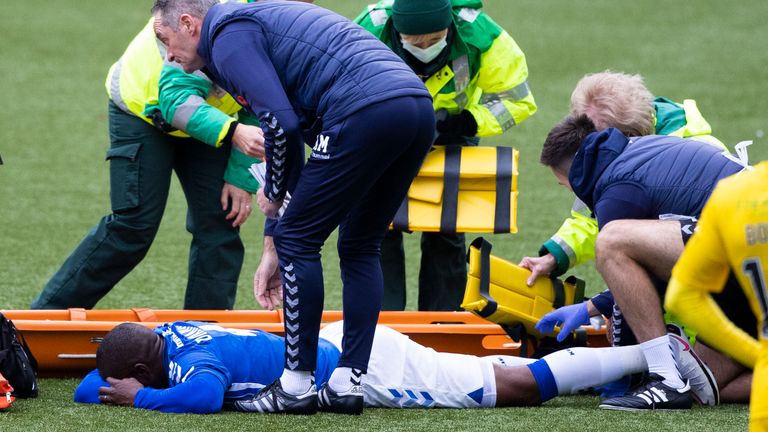 Kilmarnock Defender Clevin Dikamona receives treatment before being stretchered off