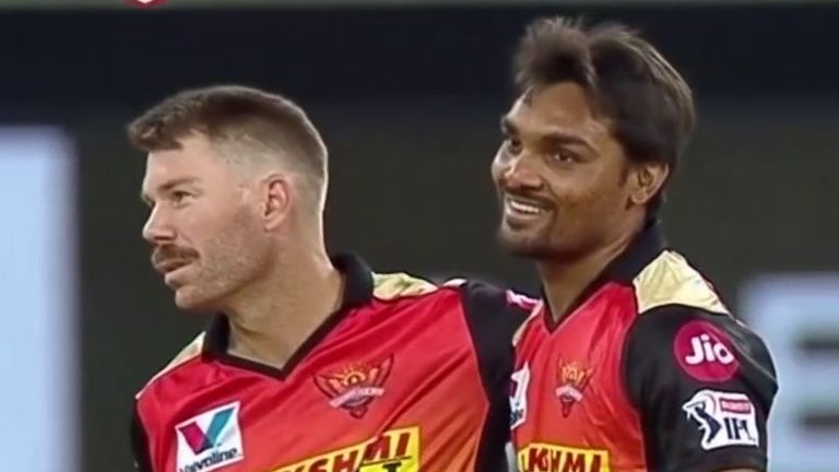 Sunrisers Hyderabad's Sandeep Sharma (R) with captain David Warner