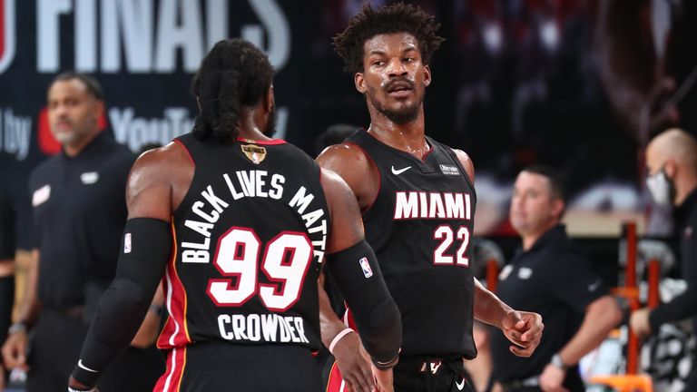 Jae Crowder high-fives Jimmy Butler of the Miami Heat during the NBA Finals 