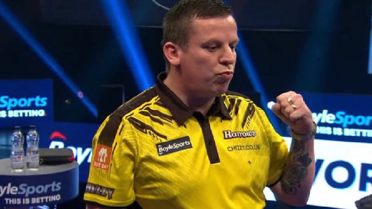 Dave Chisnall celebrates during his World Grand Prix first round game against Glen Durrant.
